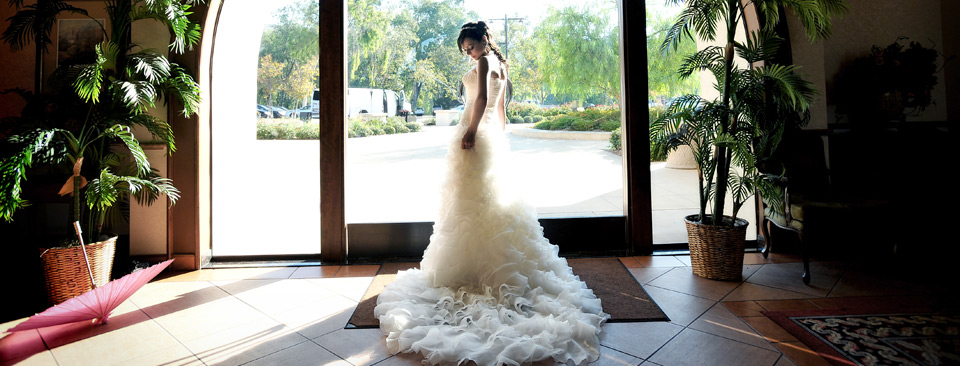 Wedding bride during a quiet moment in the entrance of the clubhouse in Anaheim Hills